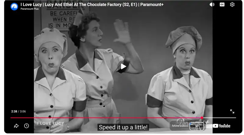 Lucy and Ethel at the chocolate factory in I Love Lucy, cheeks stuffed with chocolates as the supervisor calls to speed it up a little